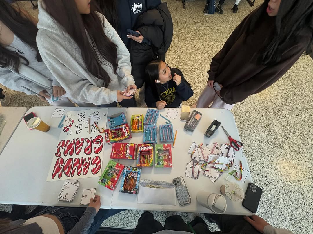 Candy cane fundraiser thank-you post with students distributing candy canes